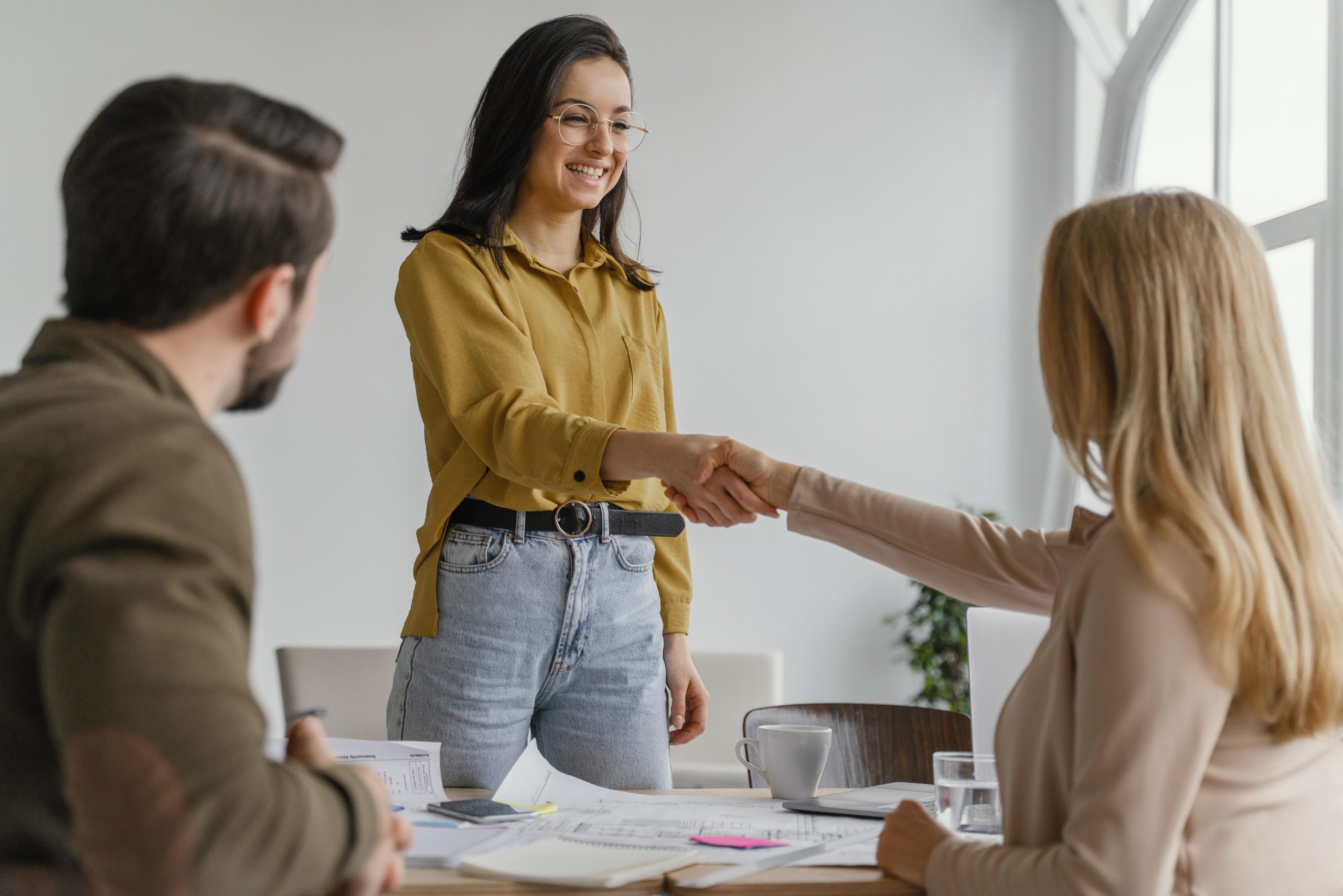 businesswomen-shaking-hands-work